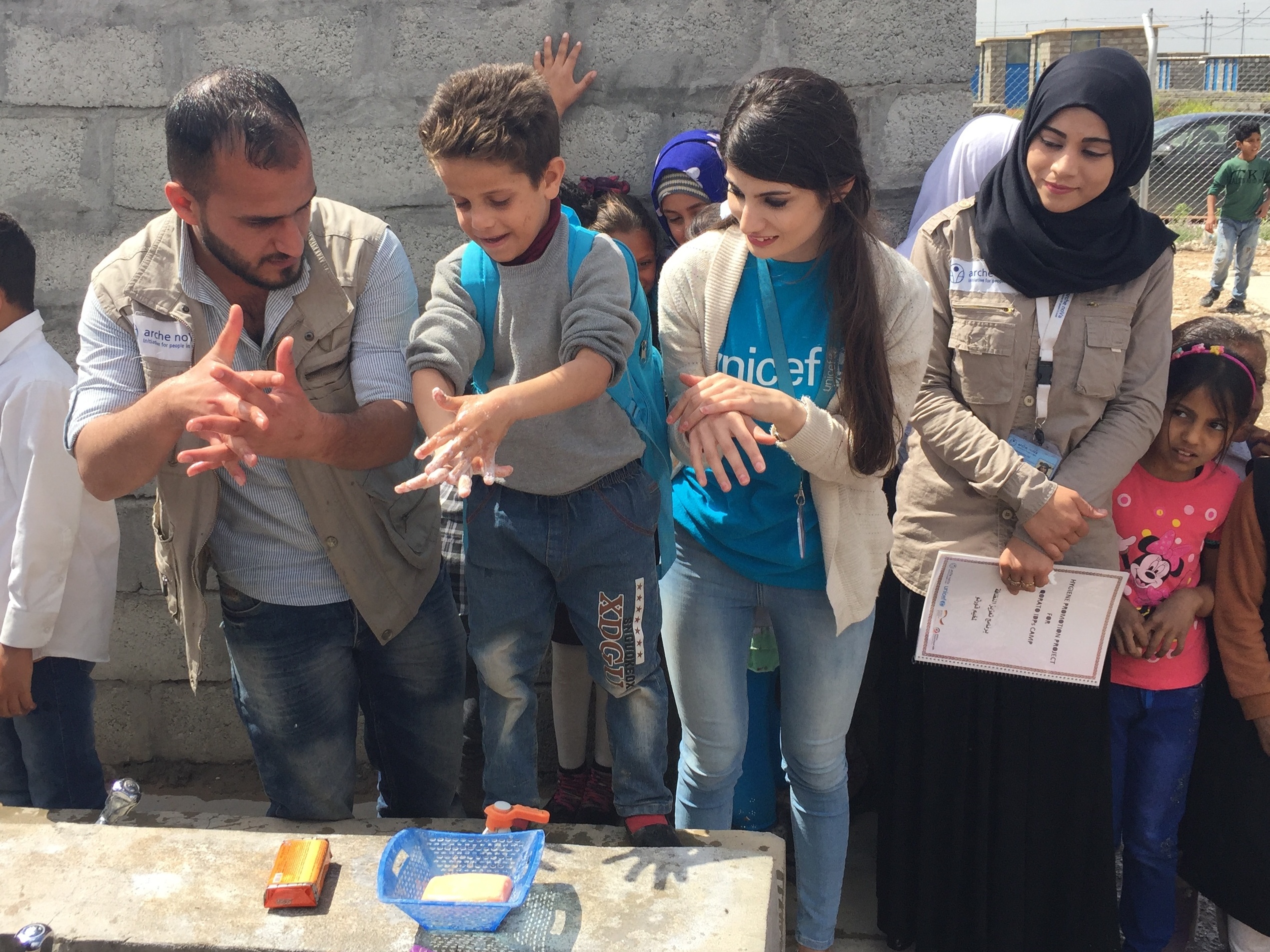 In camps and villages fled families receive water and basic aid